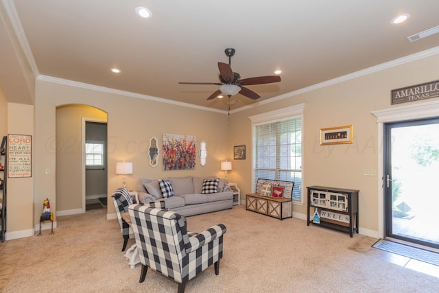 7409 Columbus Dr, Amarillo, TX 79118 - living room featuring light carpet, a ceiling fan, crown molding, recessed lighting, and arched walkways