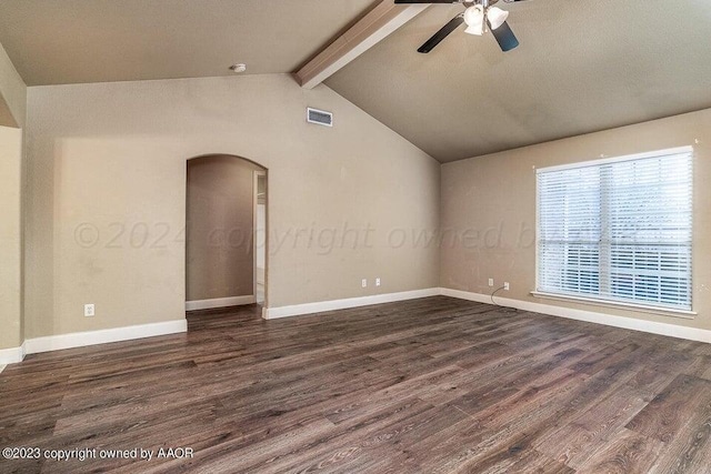 empty room featuring vaulted ceiling with beams, dark hardwood / wood-style floors, and ceiling fan