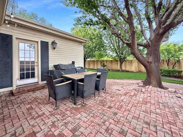 1417 Bluebonnet St, Borger, TX 79007 - view of patio / terrace with outdoor dining space and a fenced backyard