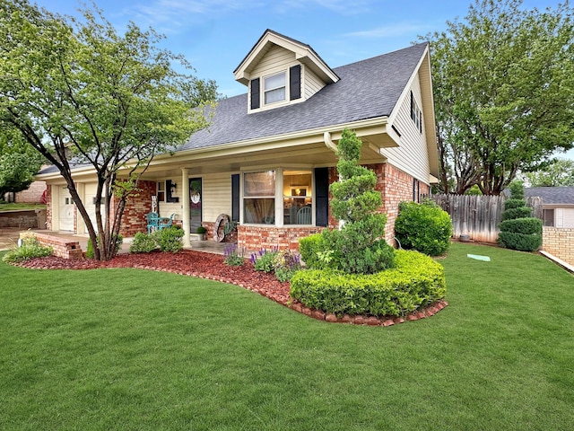 1417 Bluebonnet St, Borger, TX 79007 - view of front facade with brick siding, roof with shingles, an attached garage, and covered porch
