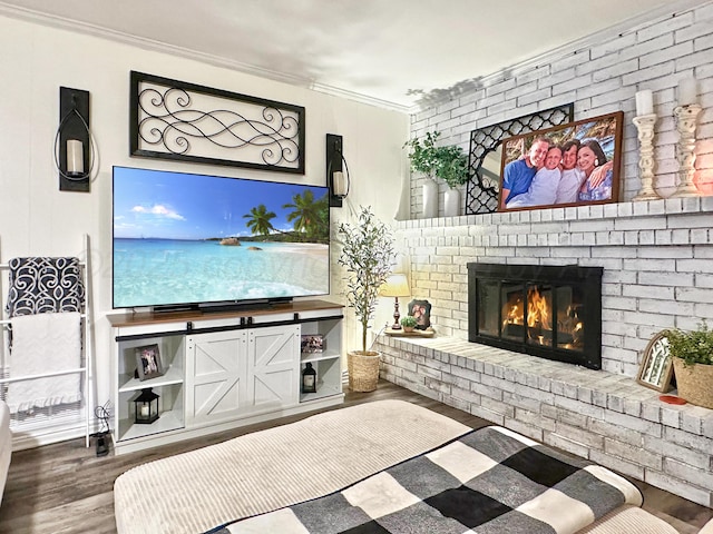 1417 Bluebonnet St, Borger, TX 79007 - living area with wood finished floors, ornamental molding, and a fireplace