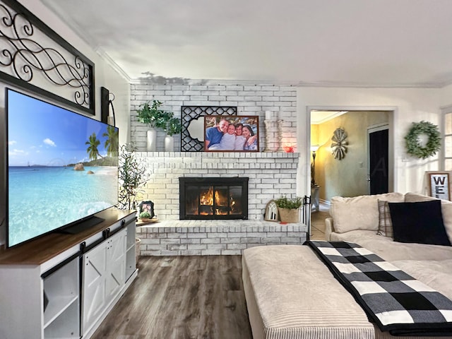 1417 Bluebonnet St, Borger, TX 79007 - living area with crown molding, a fireplace, and dark wood-style flooring