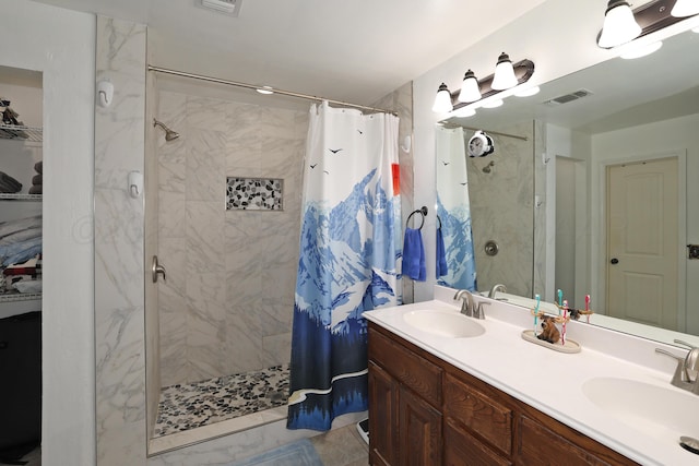 bathroom featuring walk in shower and vanity