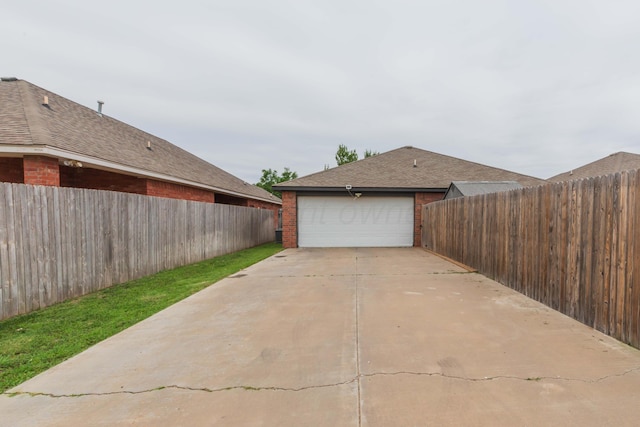 8507 Barstow Dr, Amarillo, TX 79118 - view of side of property with brick siding and a detached garage