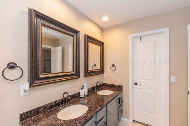 8507 Barstow Dr, Amarillo, TX 79118 - full bathroom with double vanity and baseboards