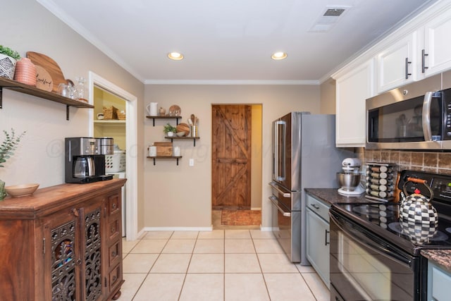 8507 Barstow Dr, Amarillo, TX 79118 - kitchen with stainless steel appliances, white cabinetry, tasteful backsplash, ornamental molding, and light tile patterned floors