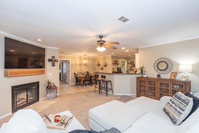 8507 Barstow Dr, Amarillo, TX 79118 - living area featuring crown molding, recessed lighting, ceiling fan, light colored carpet, and a fireplace with flush hearth