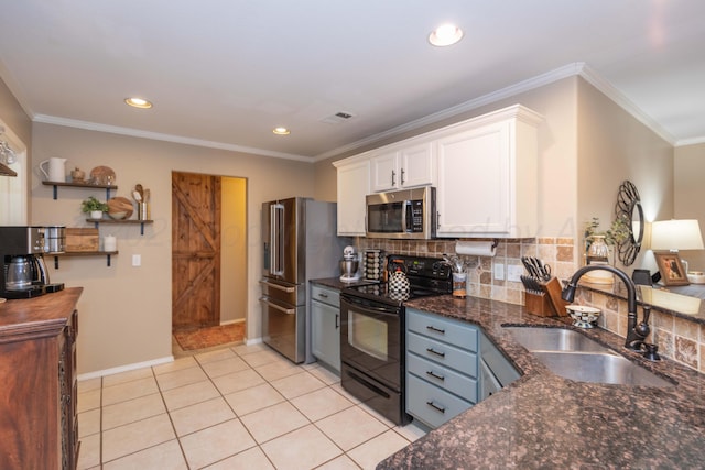 8507 Barstow Dr, Amarillo, TX 79118 - kitchen with appliances with stainless steel finishes, white cabinetry, decorative backsplash, ornamental molding, and dark stone countertops