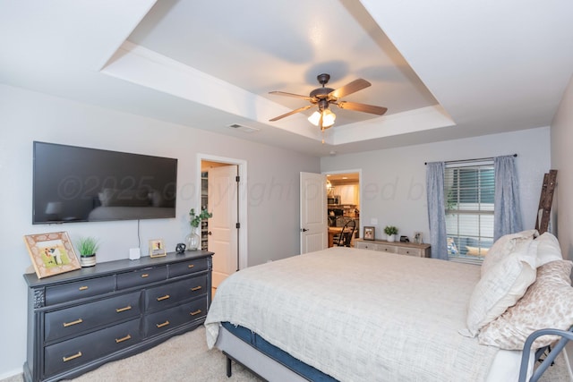 8507 Barstow Dr, Amarillo, TX 79118 - bedroom with a raised ceiling, light carpet, and ceiling fan