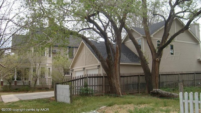 view of side of property with a garage