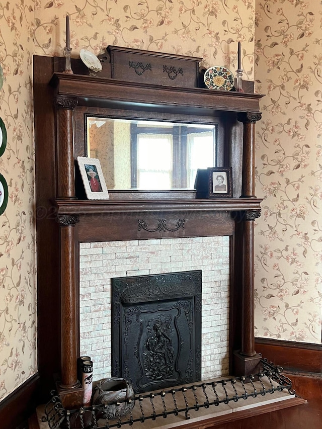 interior details with a tiled fireplace