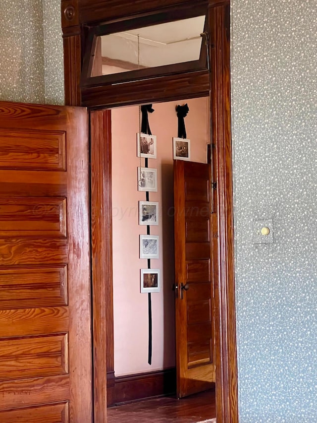 hallway with hardwood / wood-style floors