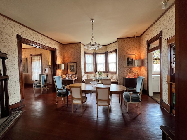 dining area featuring crown molding, dark wood-type flooring, and a wealth of natural light