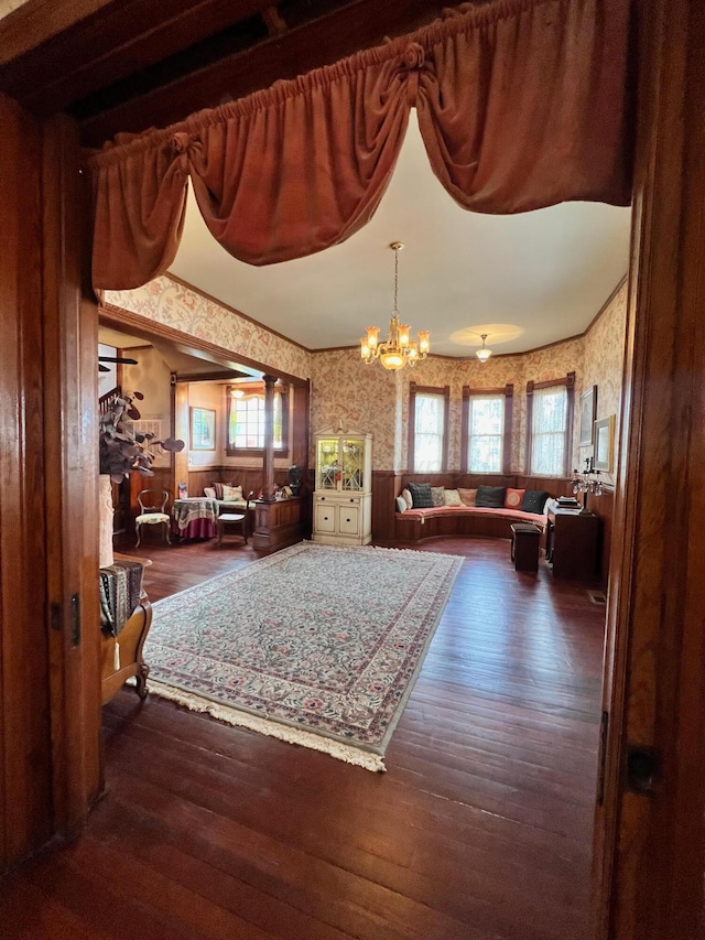 interior space with dark hardwood / wood-style flooring and a notable chandelier