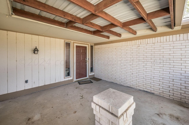 property entrance with a patio area