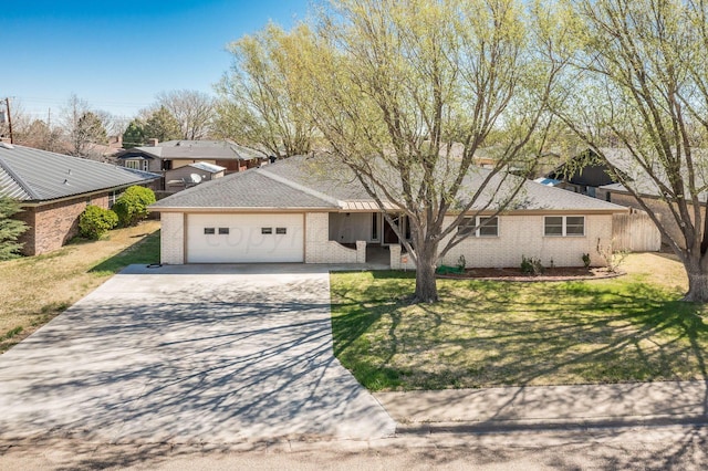 view of front of house with a front lawn and a garage