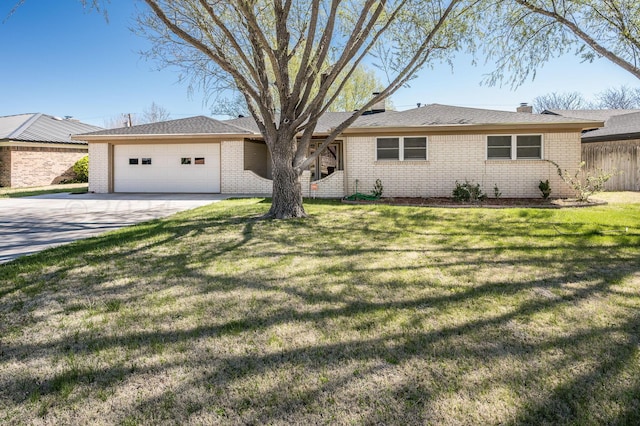 ranch-style house with a garage and a front yard