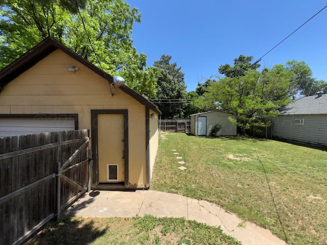 garage featuring a storage shed