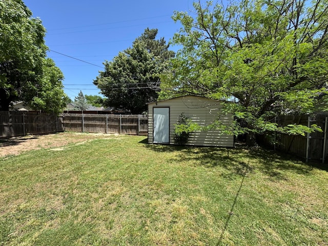 view of yard with a storage shed and an outdoor structure