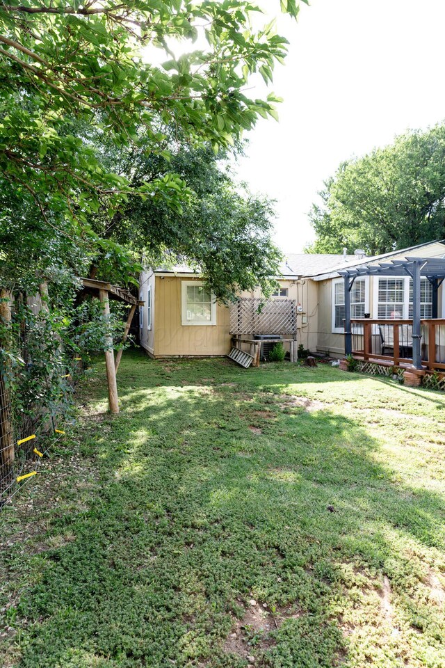 1611 S Palo Duro St, Amarillo, TX 79106 - view of yard with a wooden deck