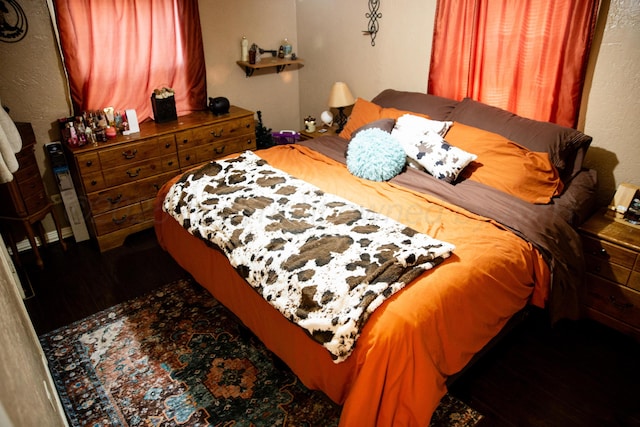 1611 S Palo Duro St, Amarillo, TX 79106 - bedroom with wood finished floors and a textured wall