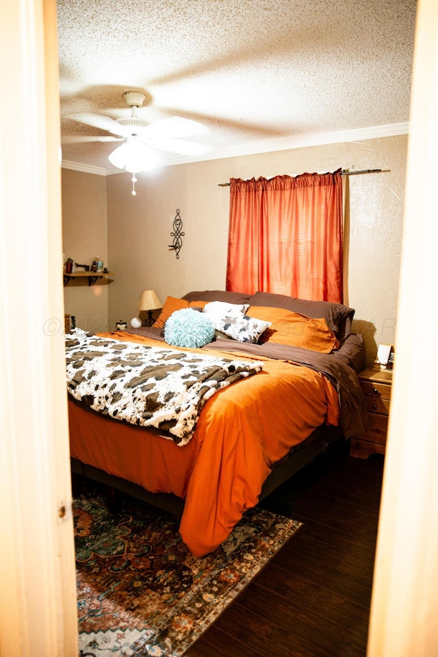 1611 S Palo Duro St, Amarillo, TX 79106 - bedroom with wood finished floors, a textured ceiling, a ceiling fan, and ornamental molding