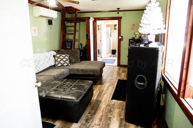 1611 S Palo Duro St, Amarillo, TX 79106 - living room featuring a wall unit AC, wood finished floors, ceiling fan, and ornamental molding