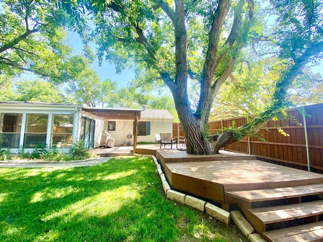 view of yard featuring a wooden deck