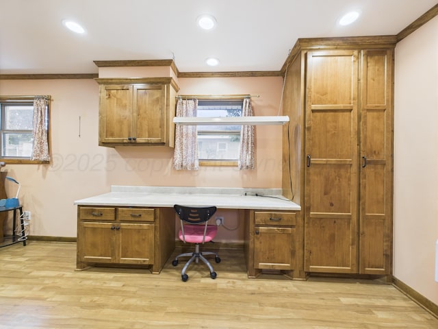 2600 Comanche Trl, Pampa, TX 79065 - office area featuring built in desk, light wood finished floors, recessed lighting, and ornamental molding