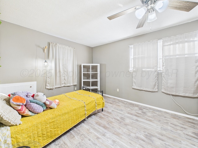 2600 Comanche Trl, Pampa, TX 79065 - bedroom with wood finished floors and ceiling fan