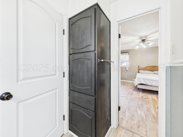 2600 Comanche Trl, Pampa, TX 79065 - washroom featuring ceiling fan and light wood-style floors