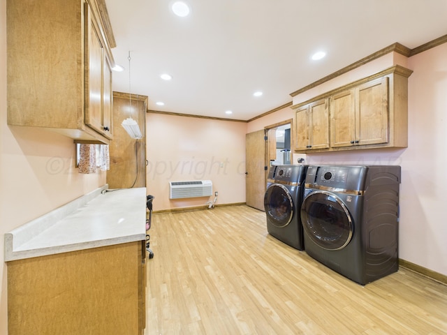 2600 Comanche Trl, Pampa, TX 79065 - washroom with washer and clothes dryer, cabinet space, crown molding, an AC wall unit, and light wood-style flooring