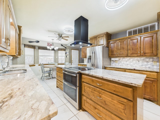 2600 Comanche Trl, Pampa, TX 79065 - kitchen featuring stainless steel appliances, island exhaust hood, a kitchen island, backsplash, and ceiling fan