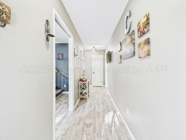 2600 Comanche Trl, Pampa, TX 79065 - hall featuring light wood-style flooring and stairway