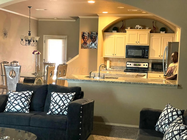 7114 Beeson St, Amarillo, TX 79119 - kitchen featuring tasteful backsplash, a sink, stainless steel appliances, light stone countertops, and ornamental molding