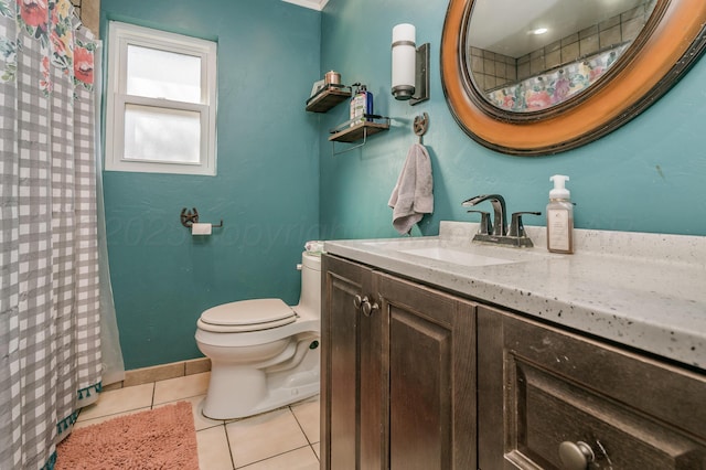 bathroom featuring tile patterned floors, toilet, and vanity