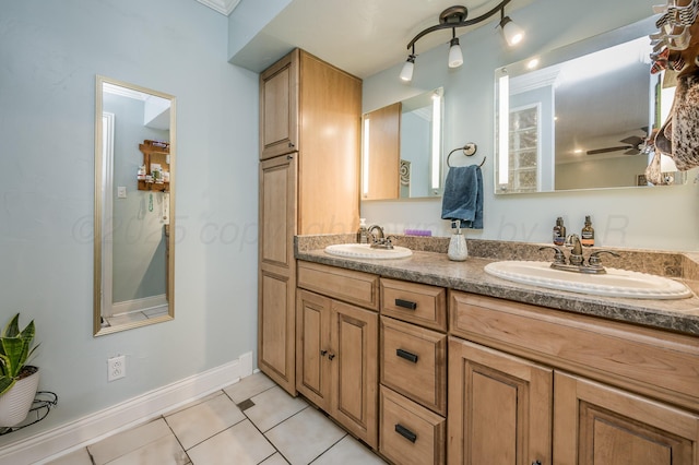bathroom with ceiling fan, vanity, and tile patterned flooring