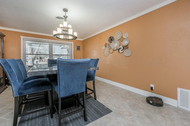 dining space with crown molding and a notable chandelier
