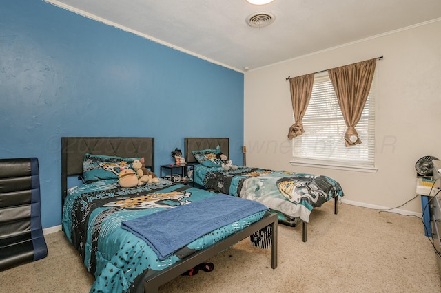 carpeted bedroom featuring crown molding