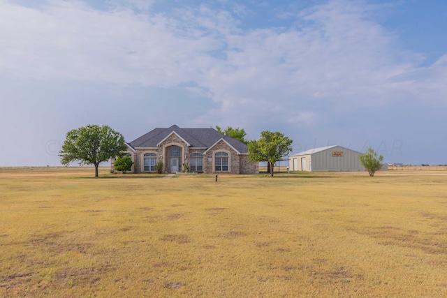 ranch-style home with a front yard