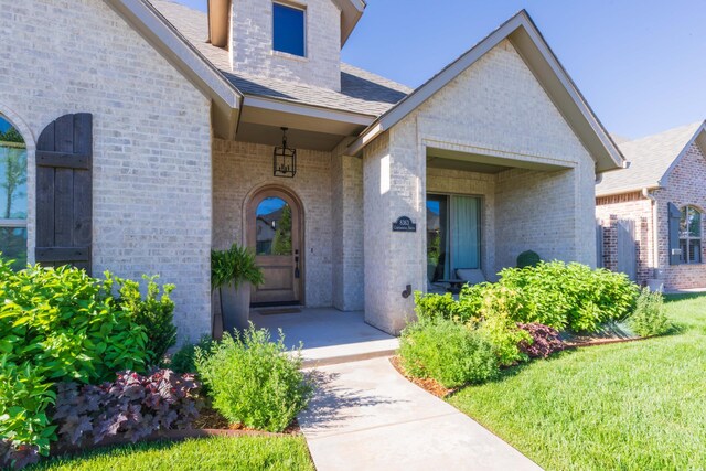 8363 S Continental Pkwy, Amarillo, TX 79119 - view of exterior entry featuring brick siding and a shingled roof