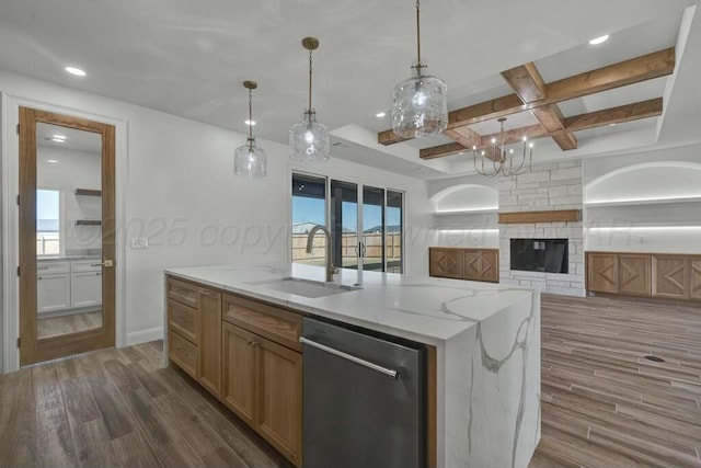 kitchen with a sink, open floor plan, dark wood-type flooring, stainless steel dishwasher, and coffered ceiling
