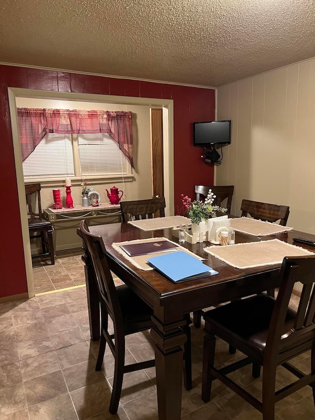 dining room featuring a textured ceiling