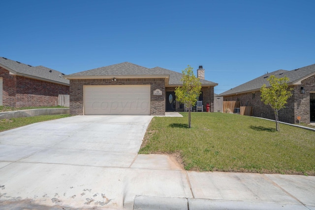 view of front of home with a front lawn and a garage