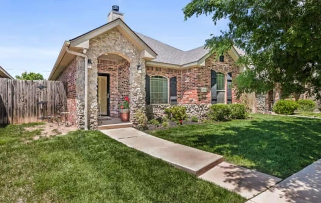 4014 Willow St, Amarillo, TX 79118 - view of front facade with brick siding, a chimney, and stone siding