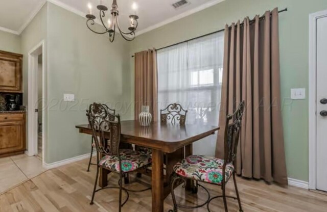 4014 Willow St, Amarillo, TX 79118 - dining space with ornamental molding, a chandelier, light wood-style flooring, and baseboards