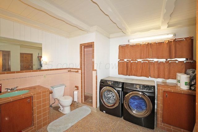 4116 Cimarron Ave, Amarillo, TX 79102 - laundry room featuring washing machine and dryer and ornamental molding