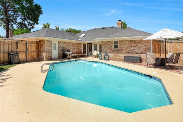 4022 Pinehurst Dr, Amarillo, TX 79109 - view of swimming pool with a patio, a grill, and a gate