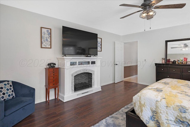 4022 Pinehurst Dr, Amarillo, TX 79109 - bedroom with wood finished floors, baseboards, a premium fireplace, and ceiling fan