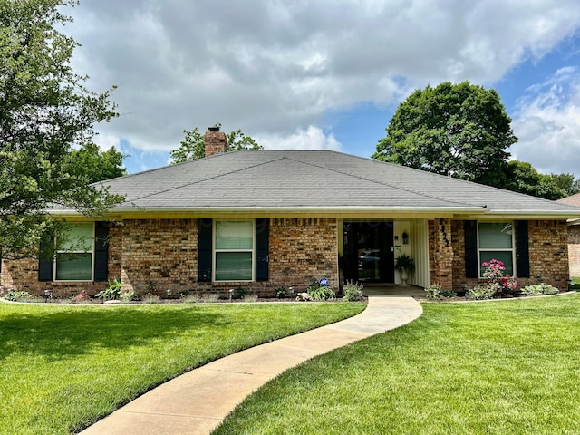 4022 Pinehurst Dr, Amarillo, TX 79109 - ranch-style home featuring a front lawn, brick siding, and a chimney